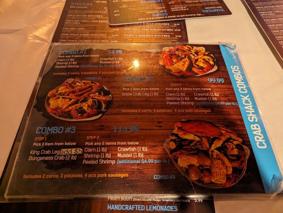 Printed menu with crab, shrimp, and chowder.